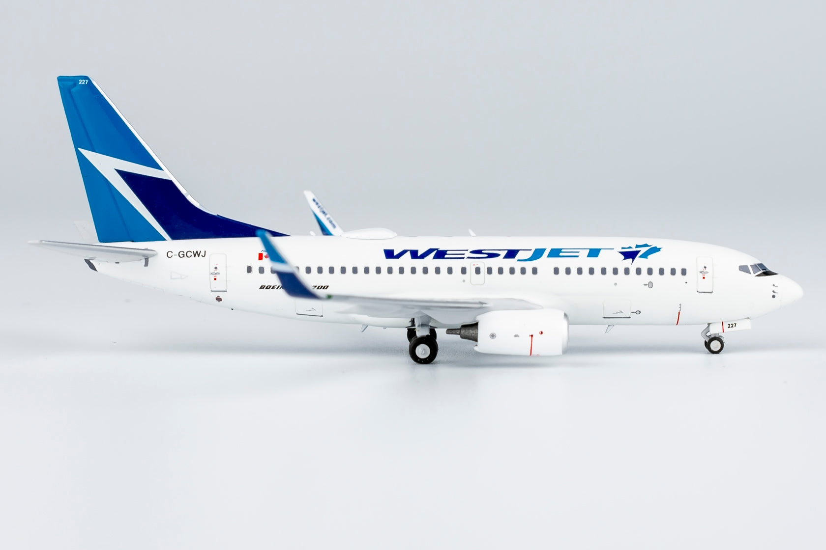 1/400 WestJet Airlines Boeing 737-700 C-GCWJ NG77038 - cover